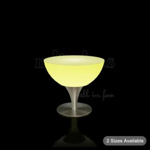 Lounge lighted high table with yellow LED glow and stainless steel base.