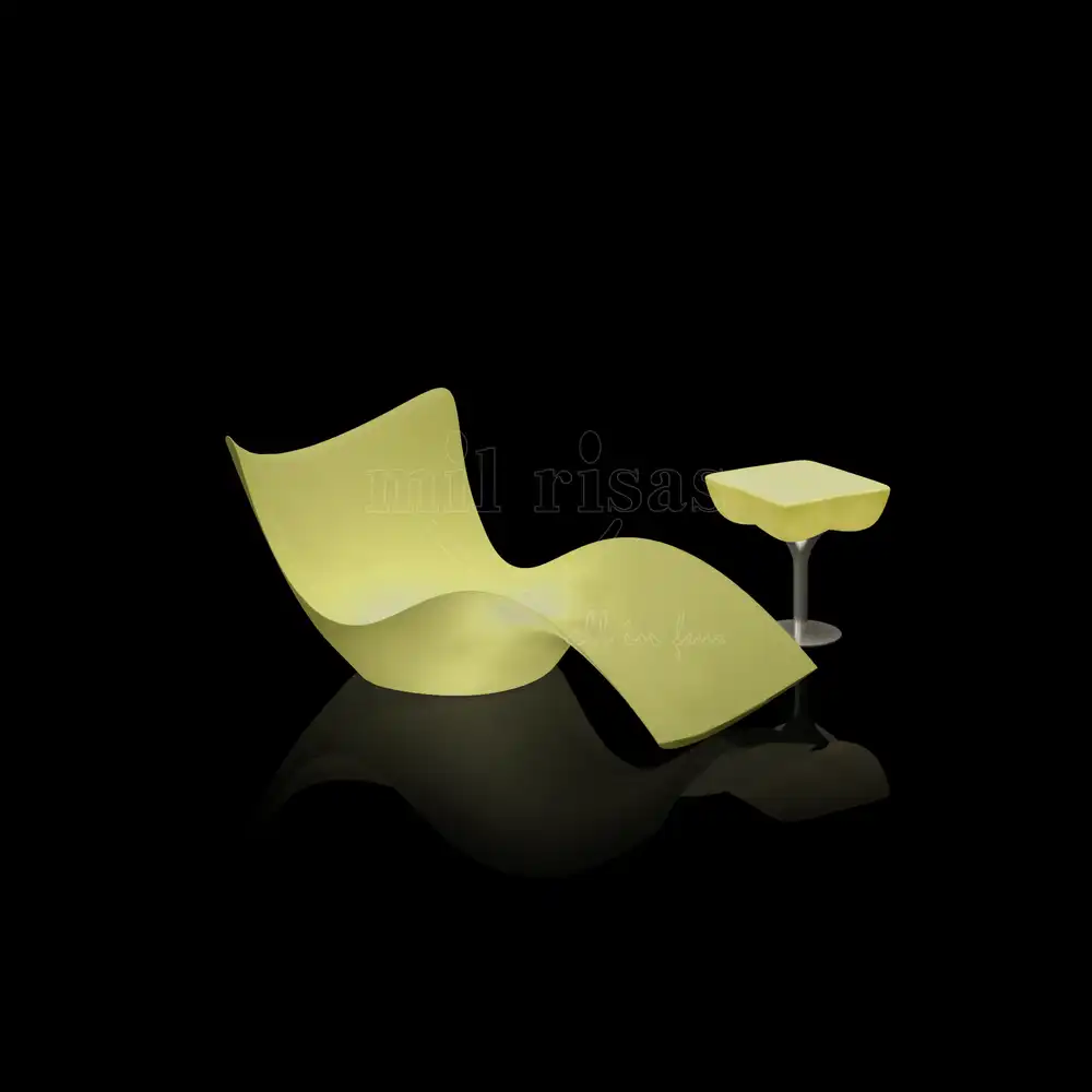 Lime green led lounge chair with matching glowing side table, modern S-curve outdoor furniture for poolside relaxation.