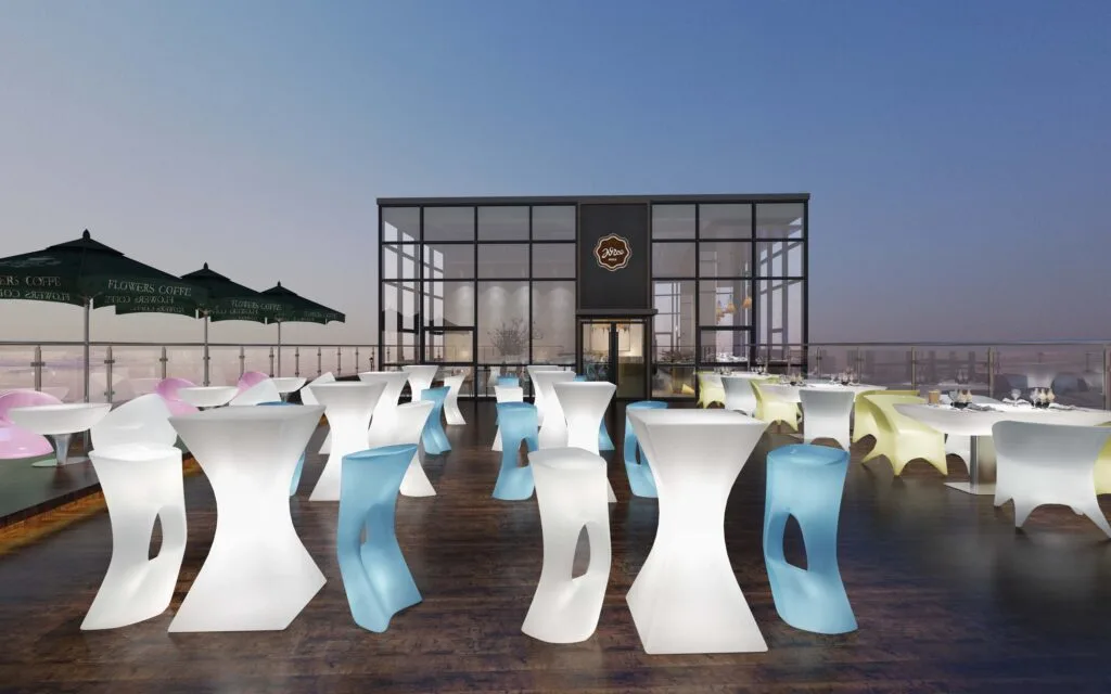 Verlichte tafels en stoelen voor buitenbarfeesten