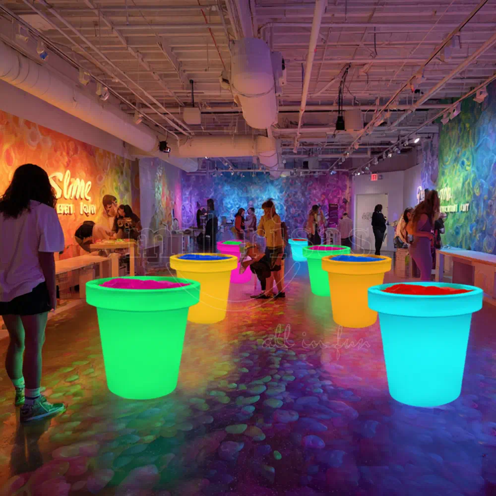 Adults Enjoying the Colorful Slime Bin in a Slime Activity Space
