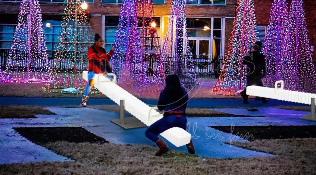 Halloween Night Scene with Glowing LED Seesaw and Purple Light Decorations Outdoors