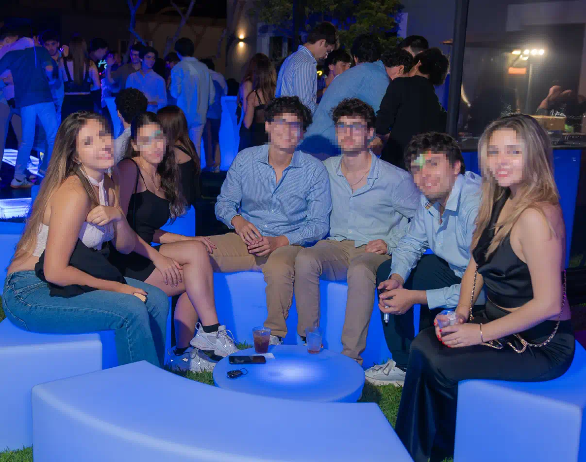 Guests Relaxing in a Glowing Stool Lounge Area with LED Glow Party Furniture