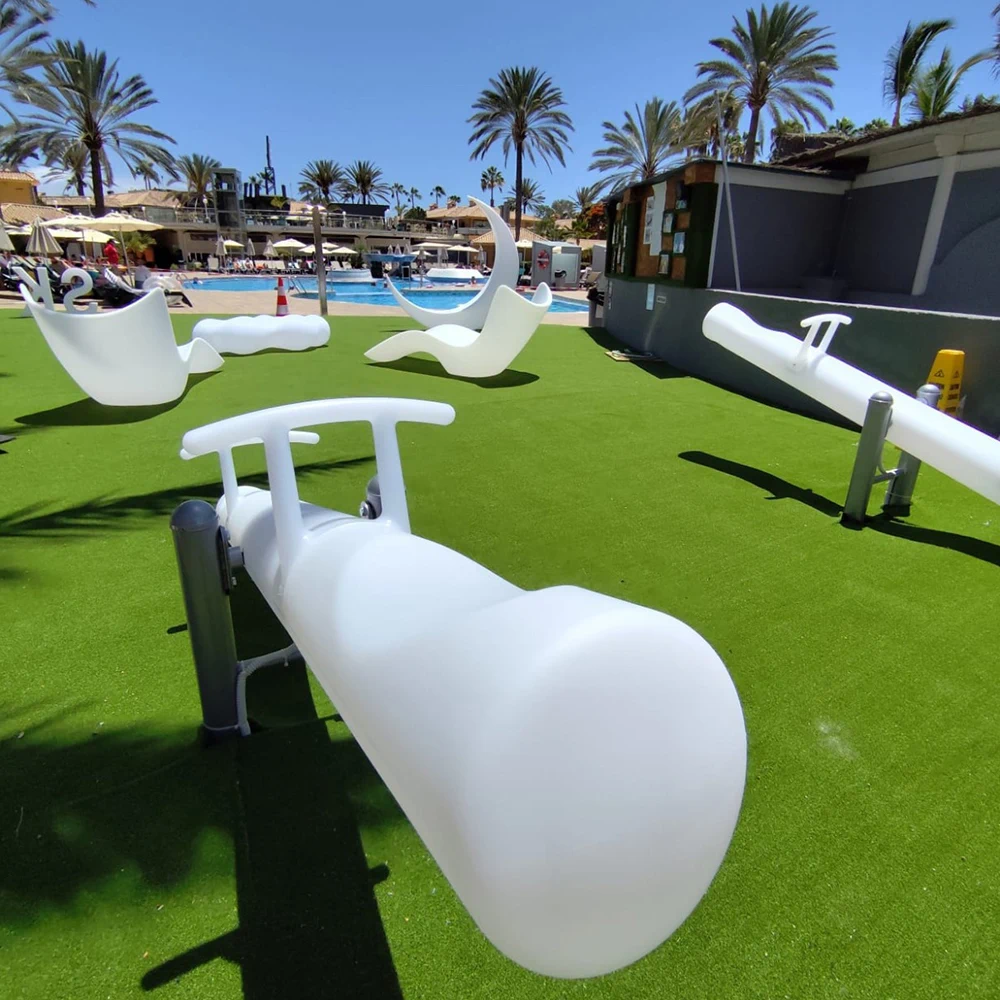 Daytime View with LED Seesaws, Cloud Seats, and Moon Chairs in Resort Setting