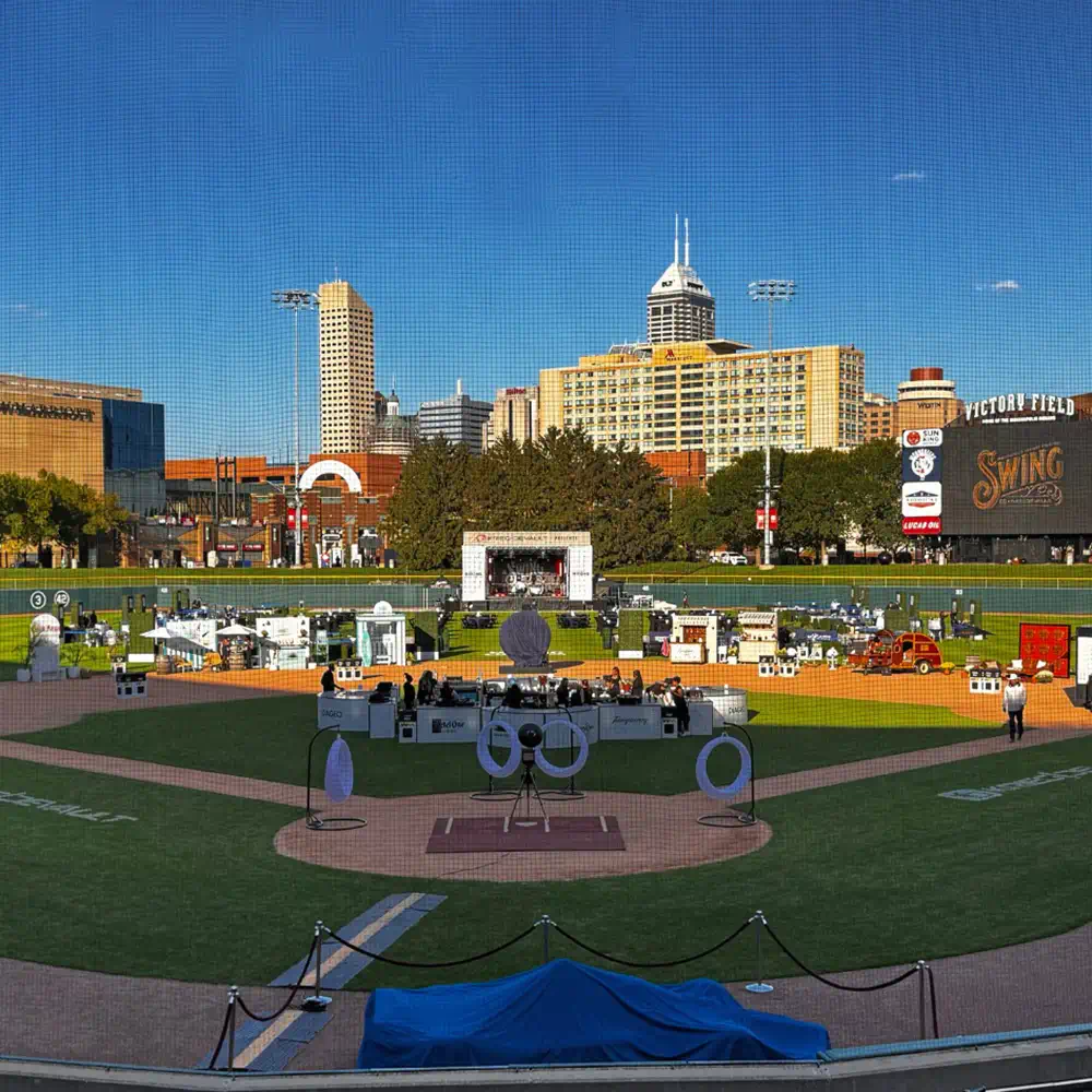 LED-Lit Swing in the Center of an Outdoor Space with LED Furniture for Charity