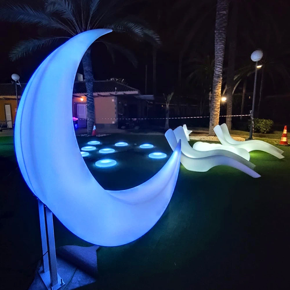 Nighttime View with Glowing Crescent Chairs, Wave Loungers, and LED Floor Tiles