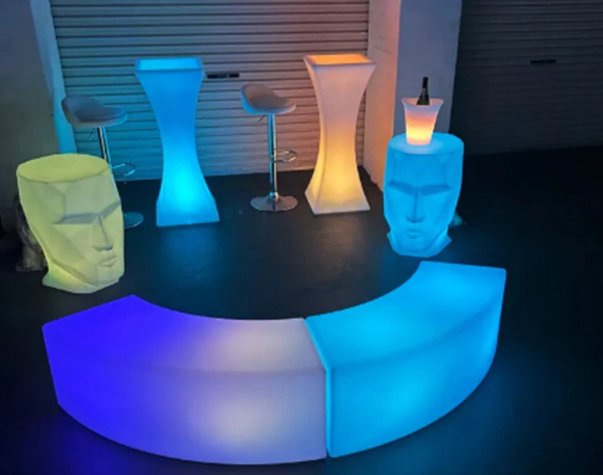 Stylish Outdoor Lounge with Wedding Event Furniture, Featuring a Blue Glowing LED Bench and Face-Shaped LED Table