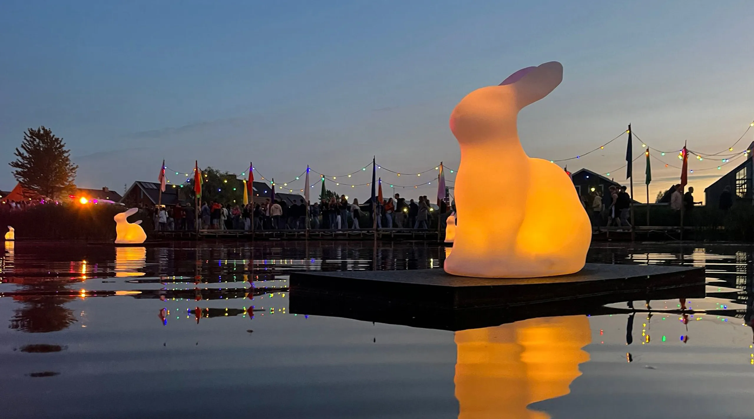 Festival Glowing Rabbit Installations Light Up Slingepark Lake at Simmerdeis Festival