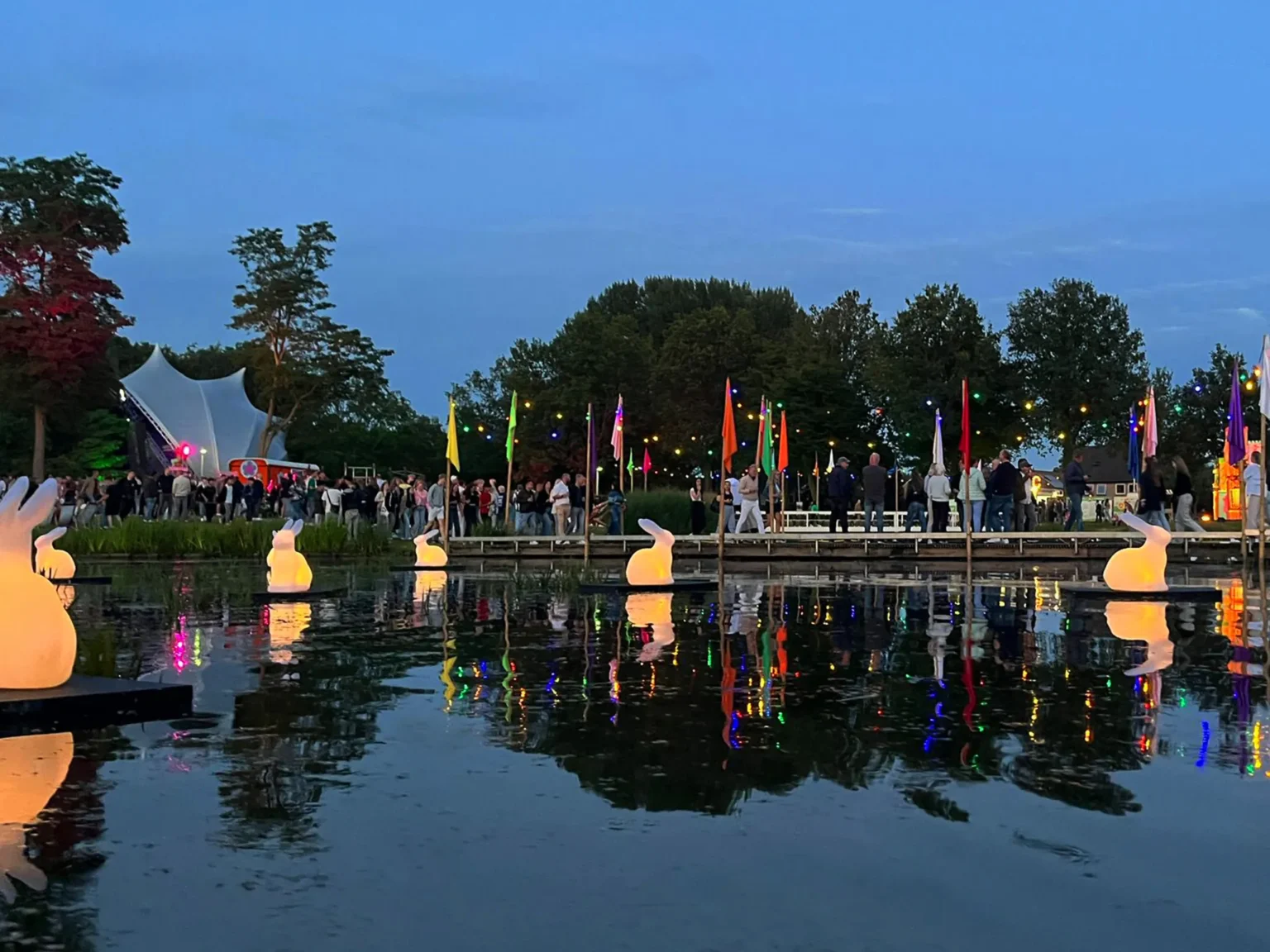 Glowing Festival Rabbits Illuminate Slingepark Lake at Simmerdeis Festival