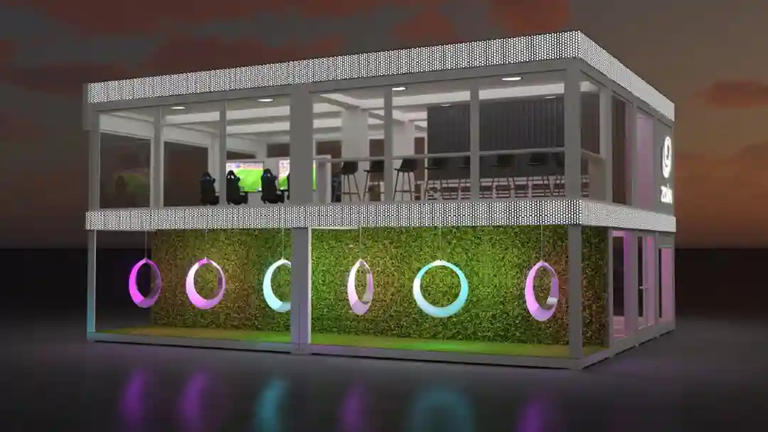 Glow in the dark circle swing chairs hanging under a modern two-story commercial building