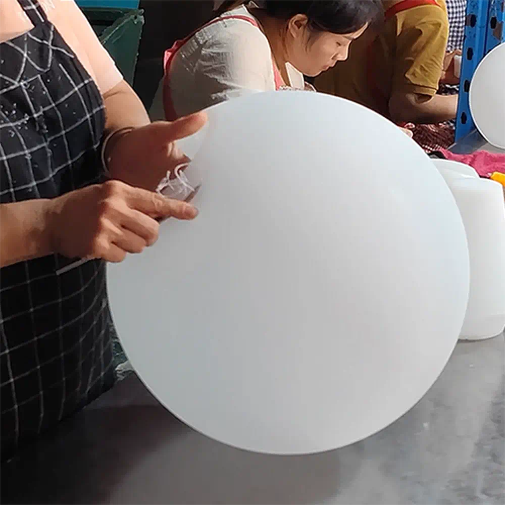 Quality Control and Manual Trimming for Premium Seamless Surface Finish on LED Sphere Lights