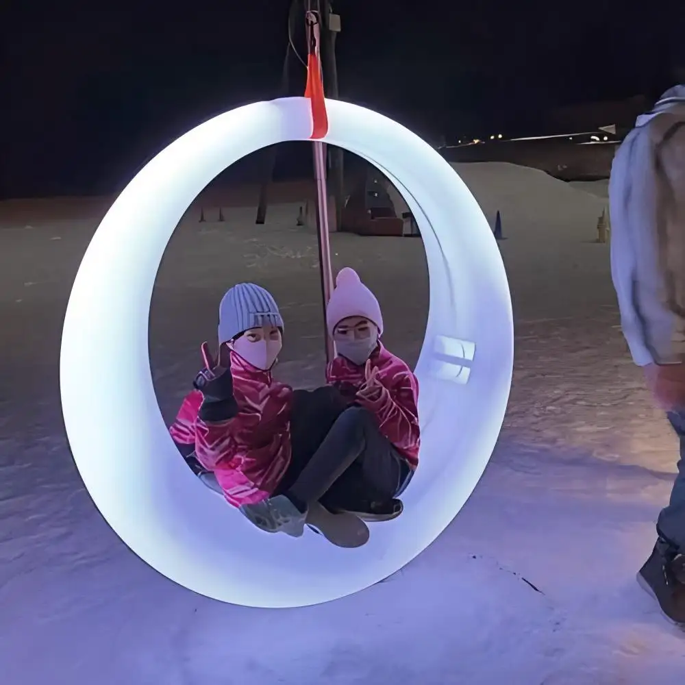 White LED glow swing for outdoor light up game in snow park