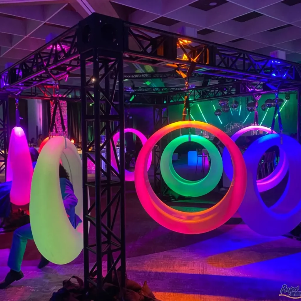 Commercial grade LED glow games various sized glowing ring swings with multi-color RGB lighting for interactive night entertainment.