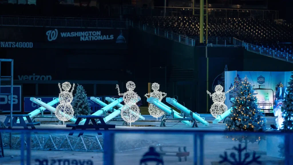 Commercial grade light up games seesaws installed at a stadium for winter festival events