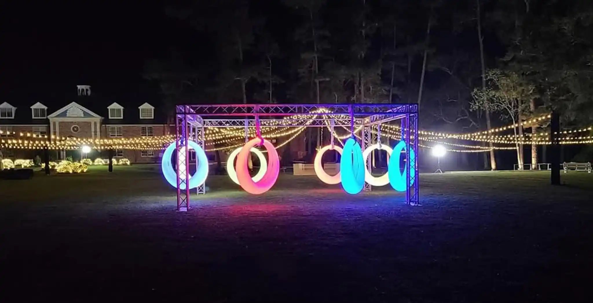 Interactive-multi-color-illuminated-rings-from-the-Glow-Circular-Swings-collection,-creating-a-festive-atmosphere-for-evening-parties