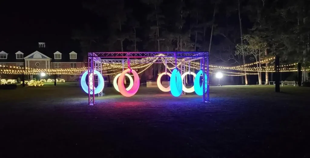 Interactive multi-color illuminated rings from the Glow Circular Swings collection, creating a festive atmosphere for evening parties