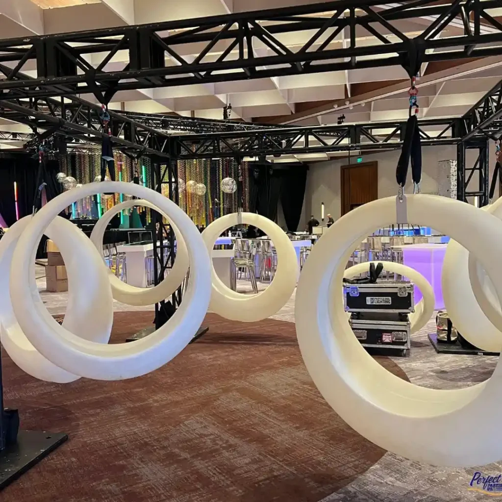 Modern and interactive LED glow games featuring durable hanging ring swings, ready to be illuminated for unforgettable events.