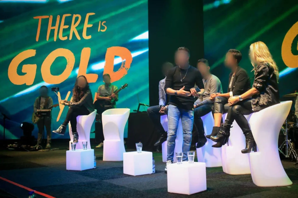 Modern furniture LED lighting used in the Hengelo event included portable LED stools (for guest seating) and illuminated cubes with glassware on stage, all equipped with RGB color control