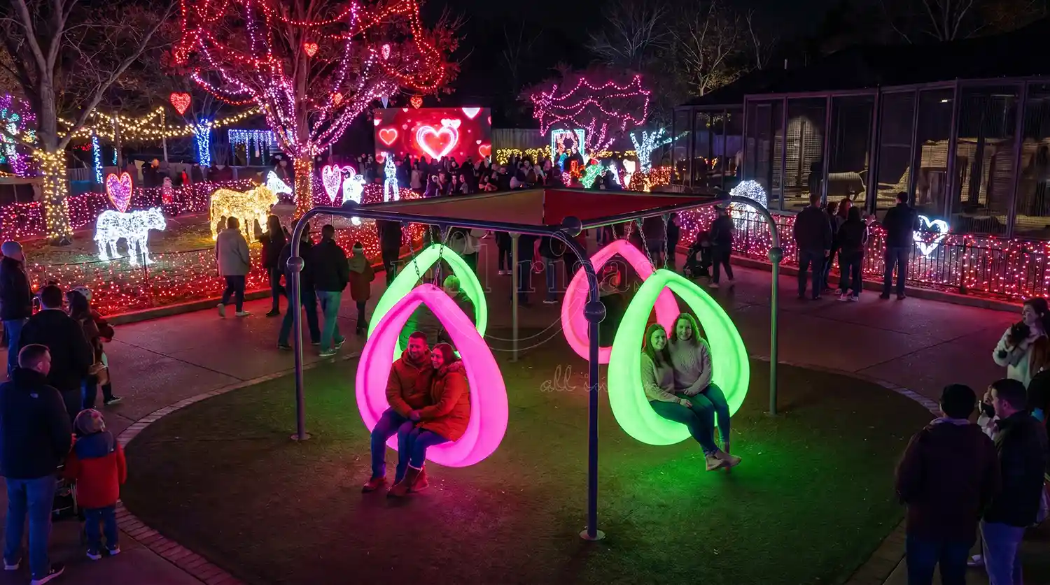 Valentine's Day light show featuring interactive LED heart-shaped swing chair, glowing festival decorations for nighttime public events.